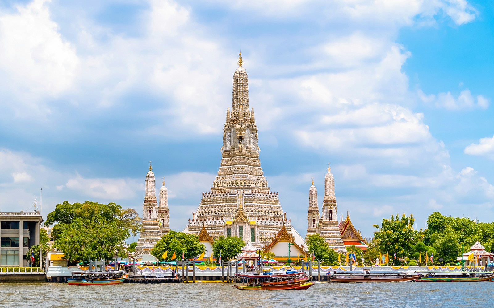 Wat Arun temple by the Chao Phraya River in Bangkok, Thailand.