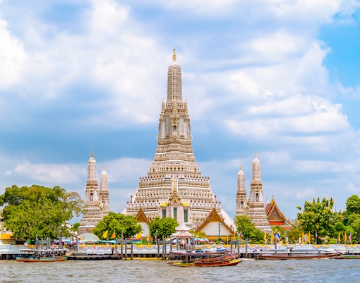 Wat Arun temple by Chao Phraya River in Bangkok