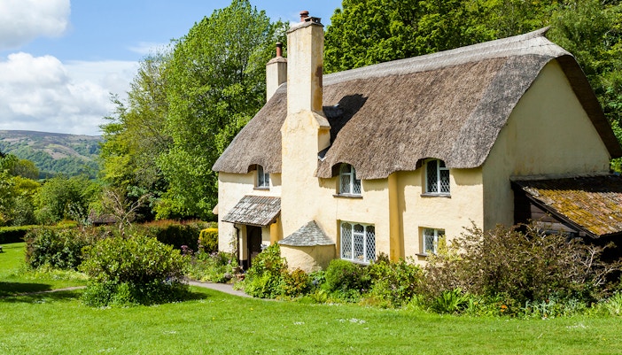 Thatched roof cottage in a typical English village.