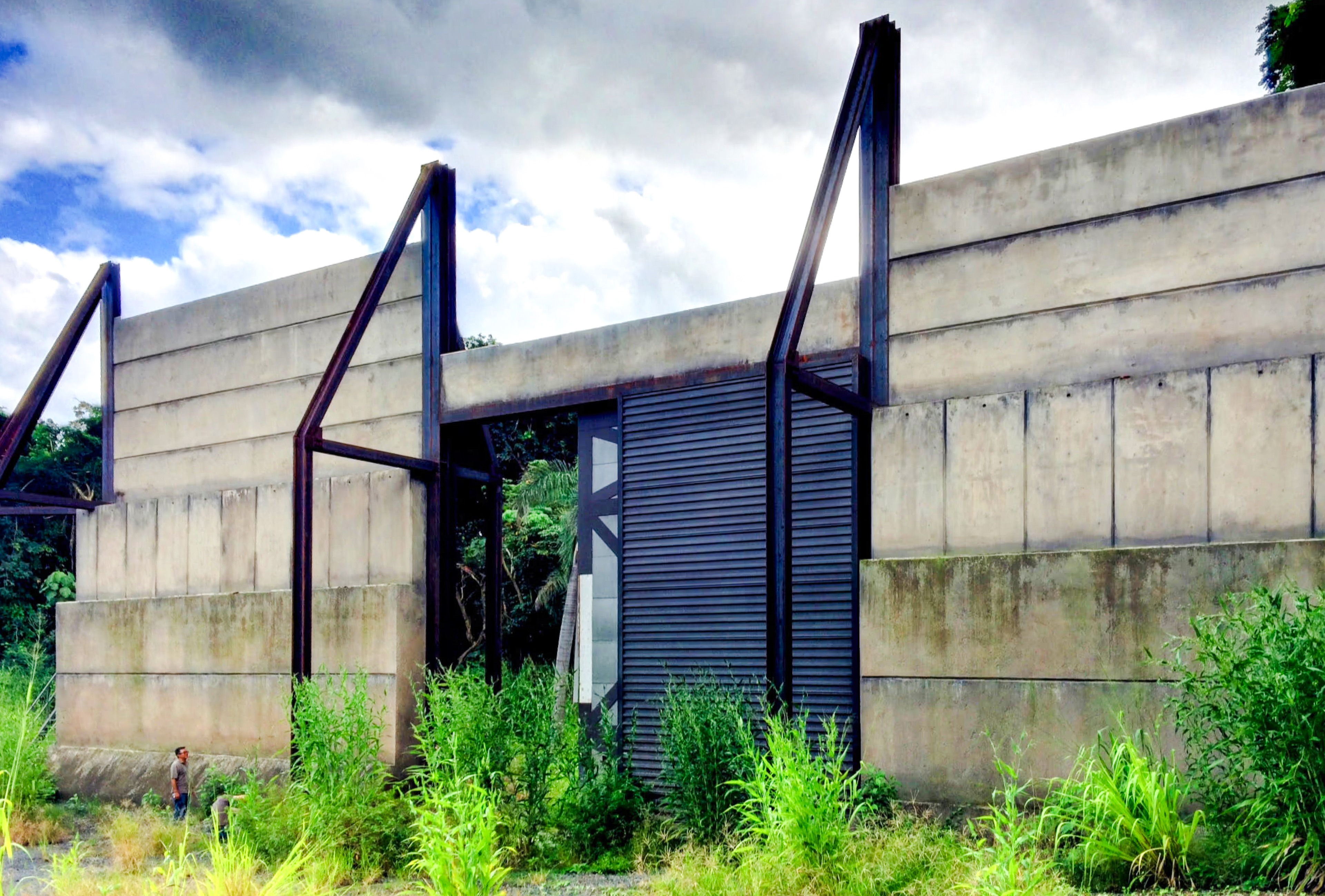 Concrete gate structure at Kualoa Ranch, Hawaii, part of the Jurassic Adventure Tour.