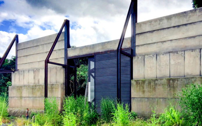 Concrete gate structure at Kualoa Ranch, Hawaii, part of the Jurassic Adventure Tour.