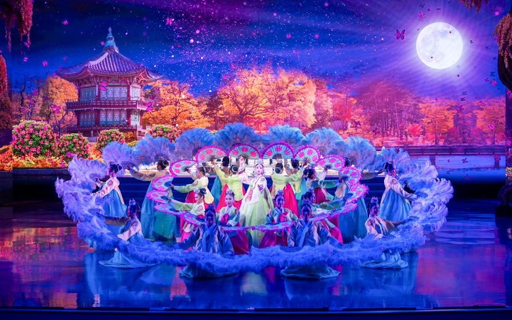 Performers in traditional costumes at Colosseum Cabaret Show Pattaya.