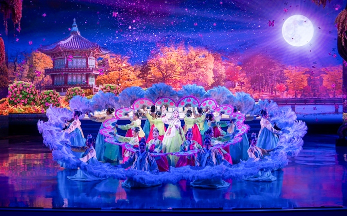 Performers in traditional costumes at Colosseum Cabaret Show Pattaya.