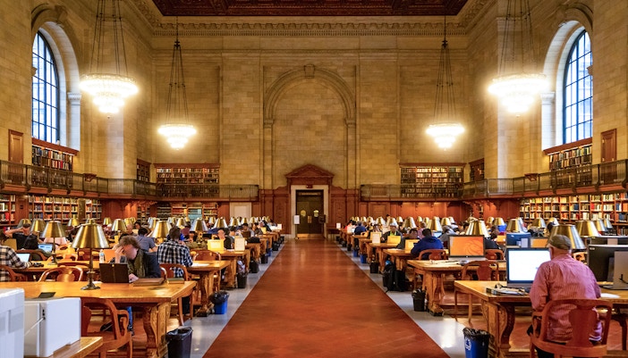 New York Public Library facade with iconic lion statues, New York City, USA.