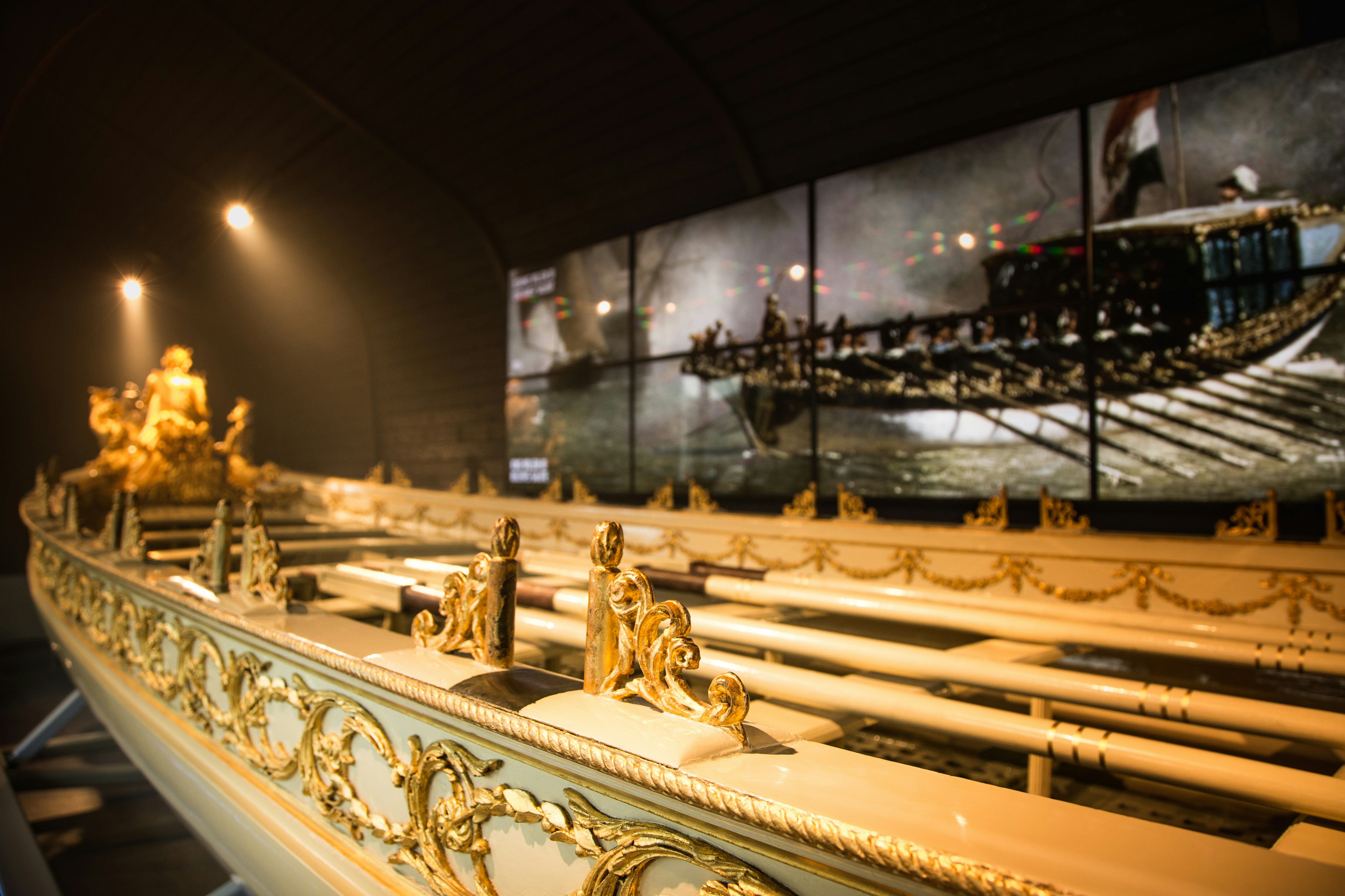 Royal Barge of King William I with ornate gold details at National Maritime Museum Amsterdam.