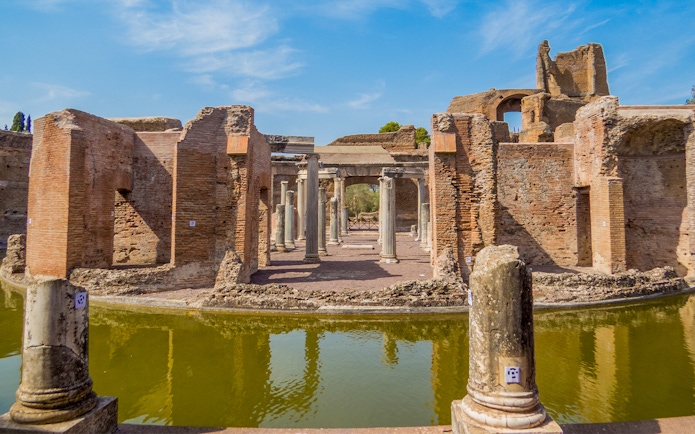 Hadrian's Villa ruins with columns and reflection in Tivoli, Italy.