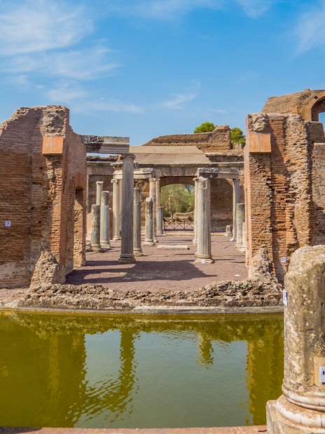 Hadrian's Villa ruins with columns and reflection in Tivoli, Italy.