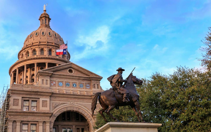 Texas Capitol building with equestrian statue, part of Ghosts of Austin exploration game.