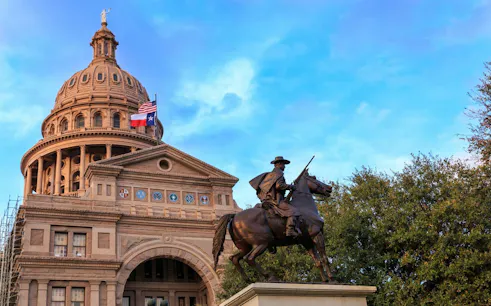 Texas Capitol building with equestrian statue, part of Ghosts of Austin exploration game.