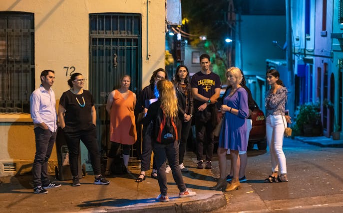 Group on Sydney's Razor Gang True Crime Tour at night.