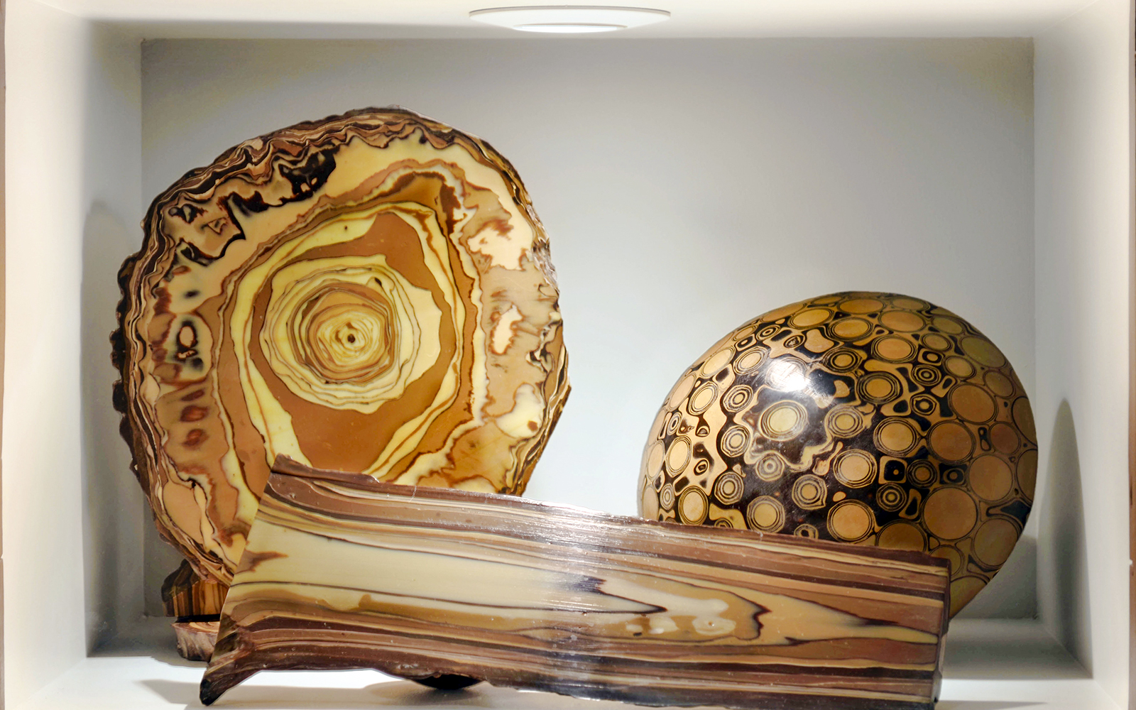 Artifacts displayed at Choco-Story Paris, featuring circular and layered designs.