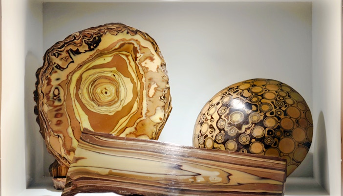 Artifacts displayed at Choco-Story Paris, featuring circular and layered designs.