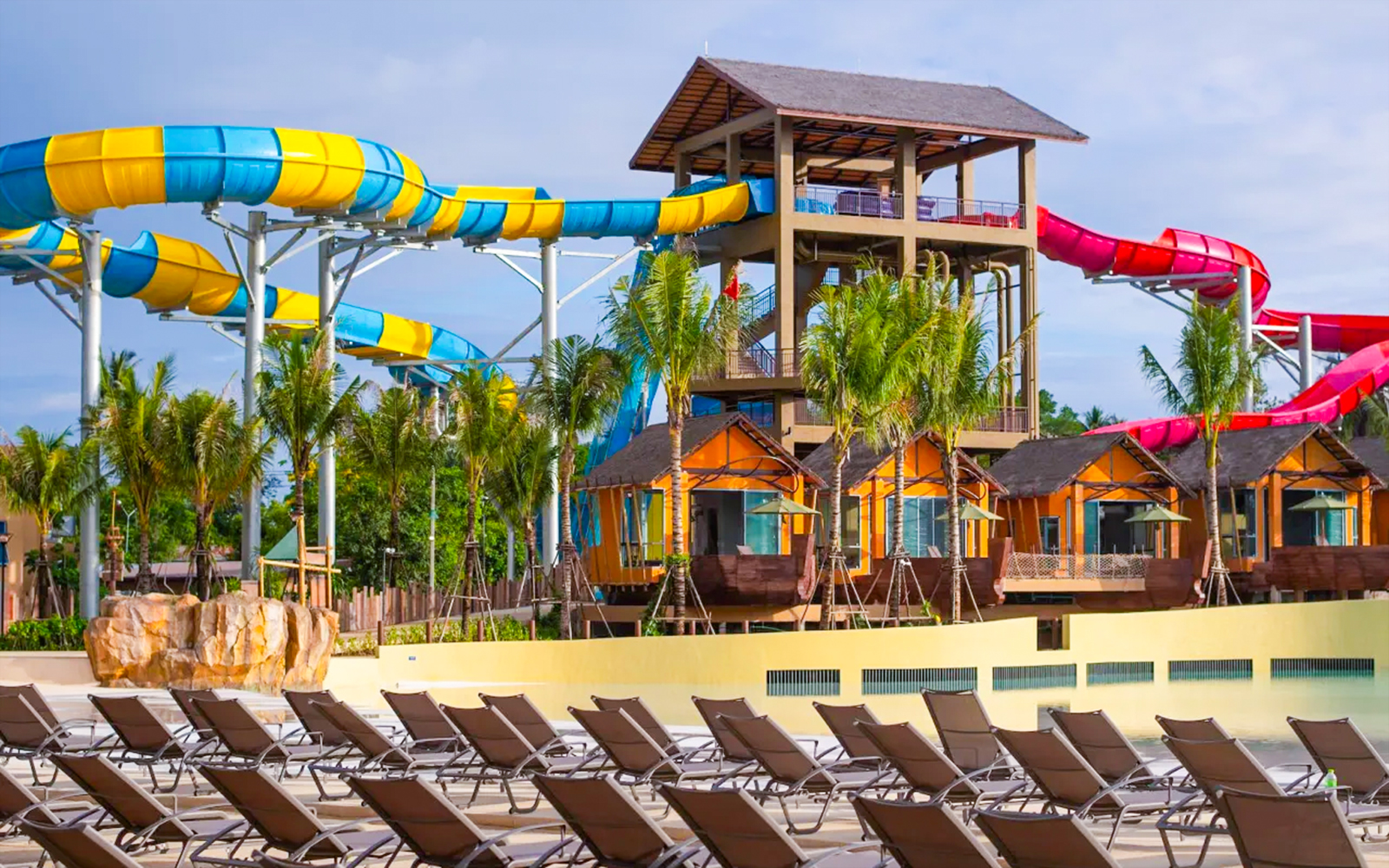 Water slides and lounge chairs at Andamanda Stage, Andamanda Phuket.