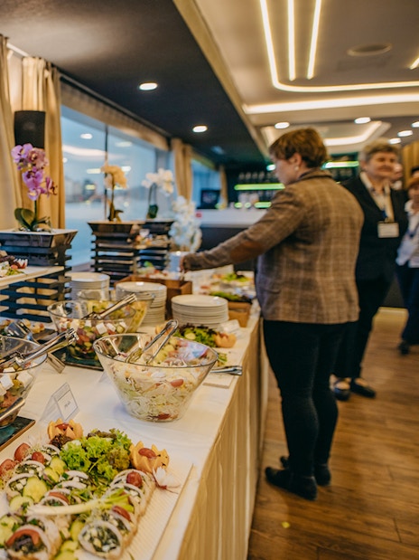 Buffet spread on New Year's Eve dinner cruise with river view in Budapest.
