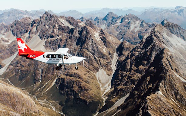 Scenic flight over mountains during Milford Sound tour from Queenstown.