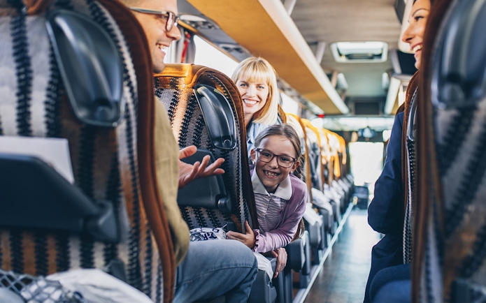 Passengers enjoying a ride on a Terravision bus from Fiumicino Airport to Rome City Center.