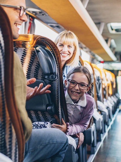 Passengers enjoying a ride on a Terravision bus from Fiumicino Airport to Rome City Center.