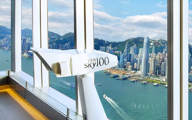 Sky100 observation deck view of Hong Kong skyline and Victoria Harbour.