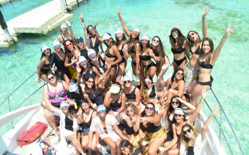 Group enjoying Punta Cana party boat cruise with snorkeling and open bar.