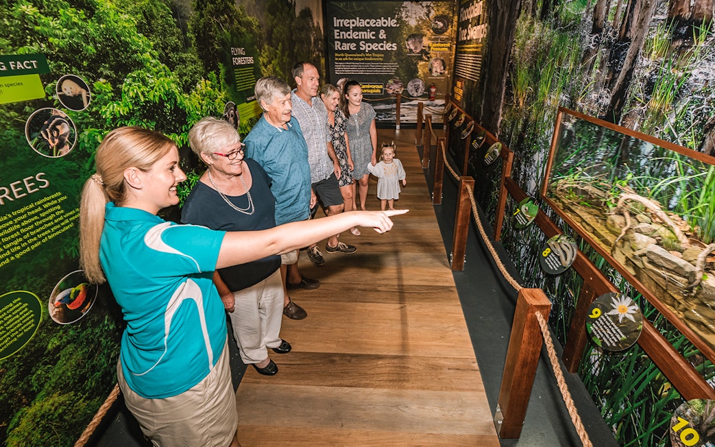Visitors exploring exhibits at Cairns Aquarium by Twilight tour.