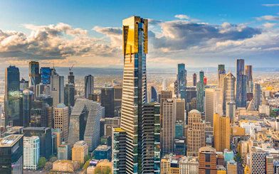 Melbourne cityscape with Eureka Tower and surrounding skyscrapers.