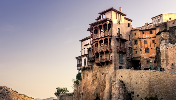 Cuenca's hanging houses perched on a cliffside in Spain.
