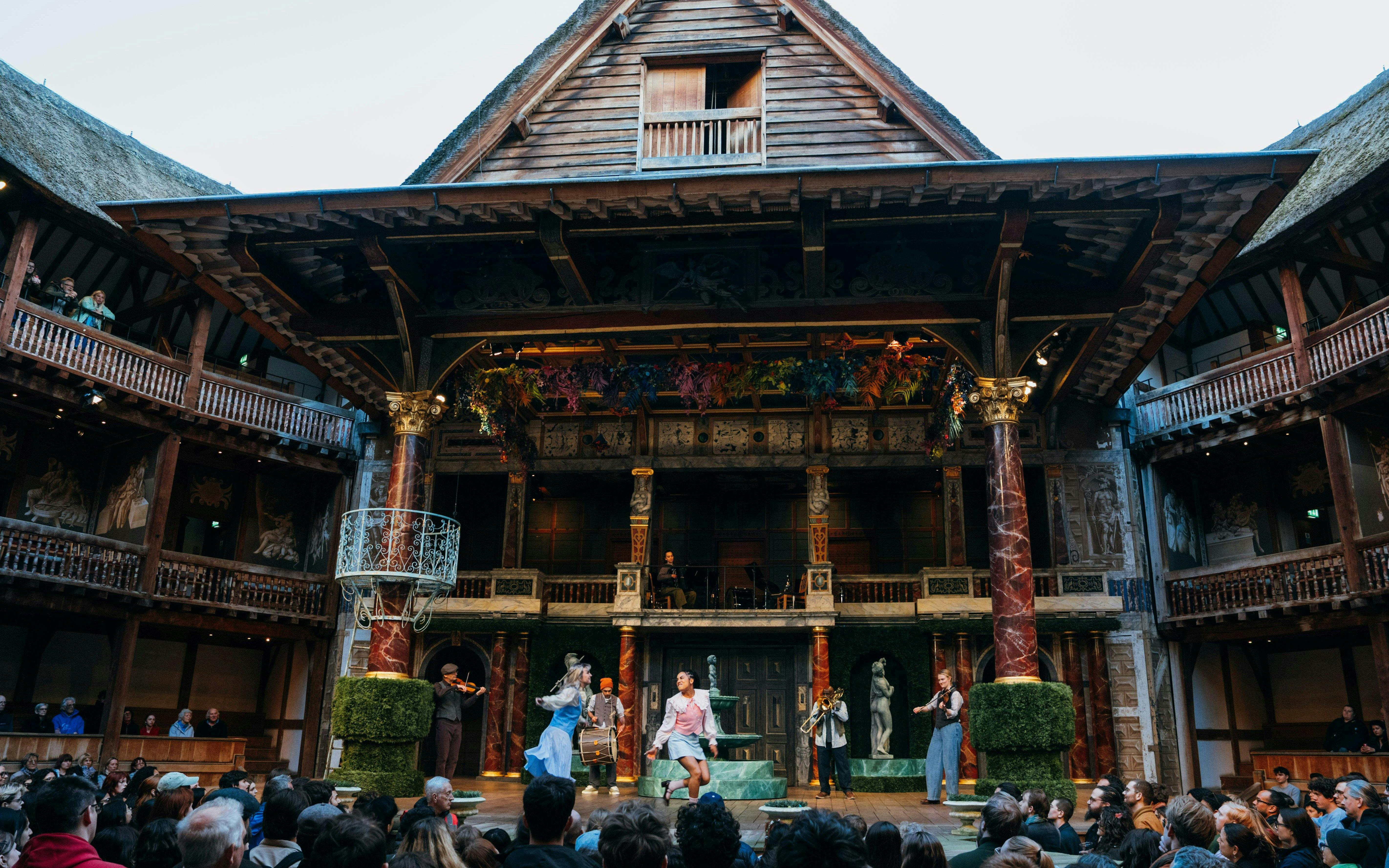 Stage performance of A Midsummer Night’s Dream at Westend theater with actors and musicians.