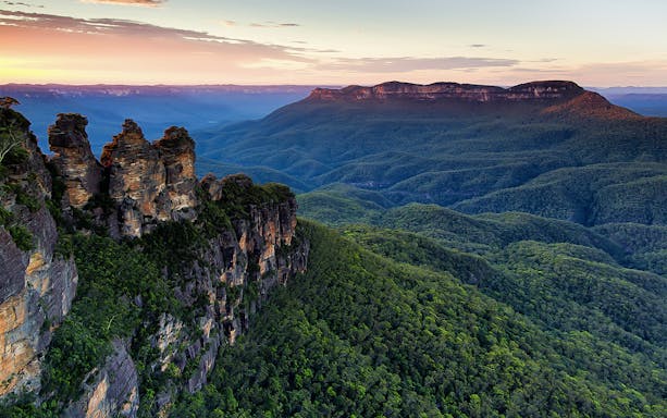 Three Sisters rock formation at sunset in Blue Mountains, Sydney, Australia.