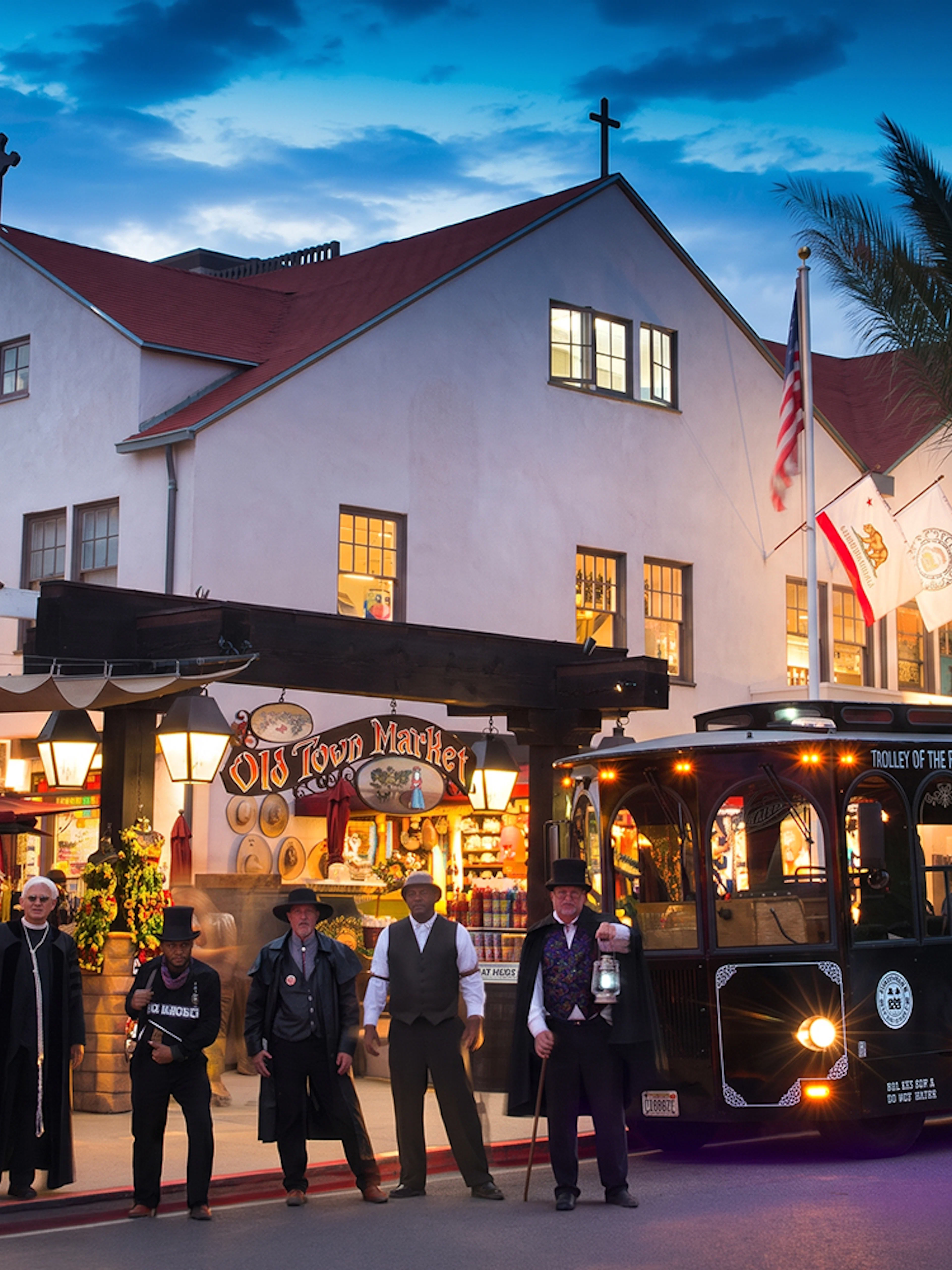 San Diego Ghosts & Gravestones tour trolley at Old Town Market with costumed guides.