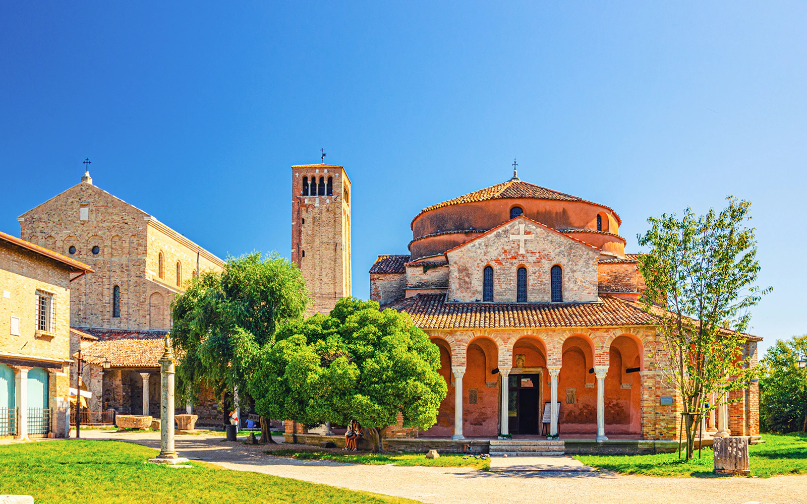 Torcello Cathedral with bell tower on Torcello Island, part of Murano, Burano & Torcello Islands tour.