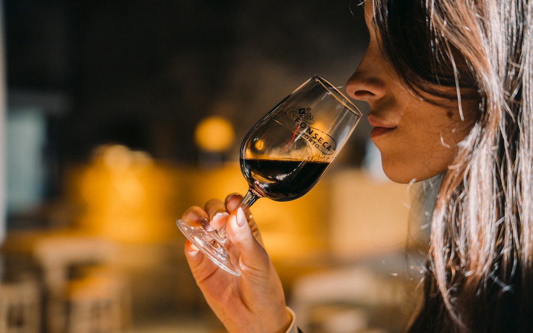 Visitor tasting wine at Fonseca Port Wine Cellars.