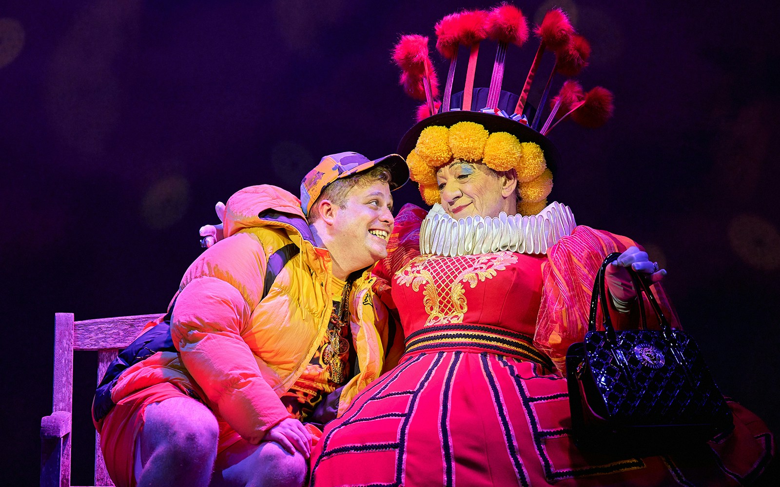 Mother Goose pantomime performance at London theater with vibrant costumes and lively stage setting.