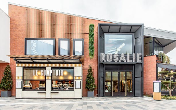 Rosalie’s Snack & Go entrance with Le Comptoir storefront in a modern building.