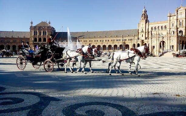 Horse-drawn carriage at Plaza de España, Seville during guided day tour from Malaga.