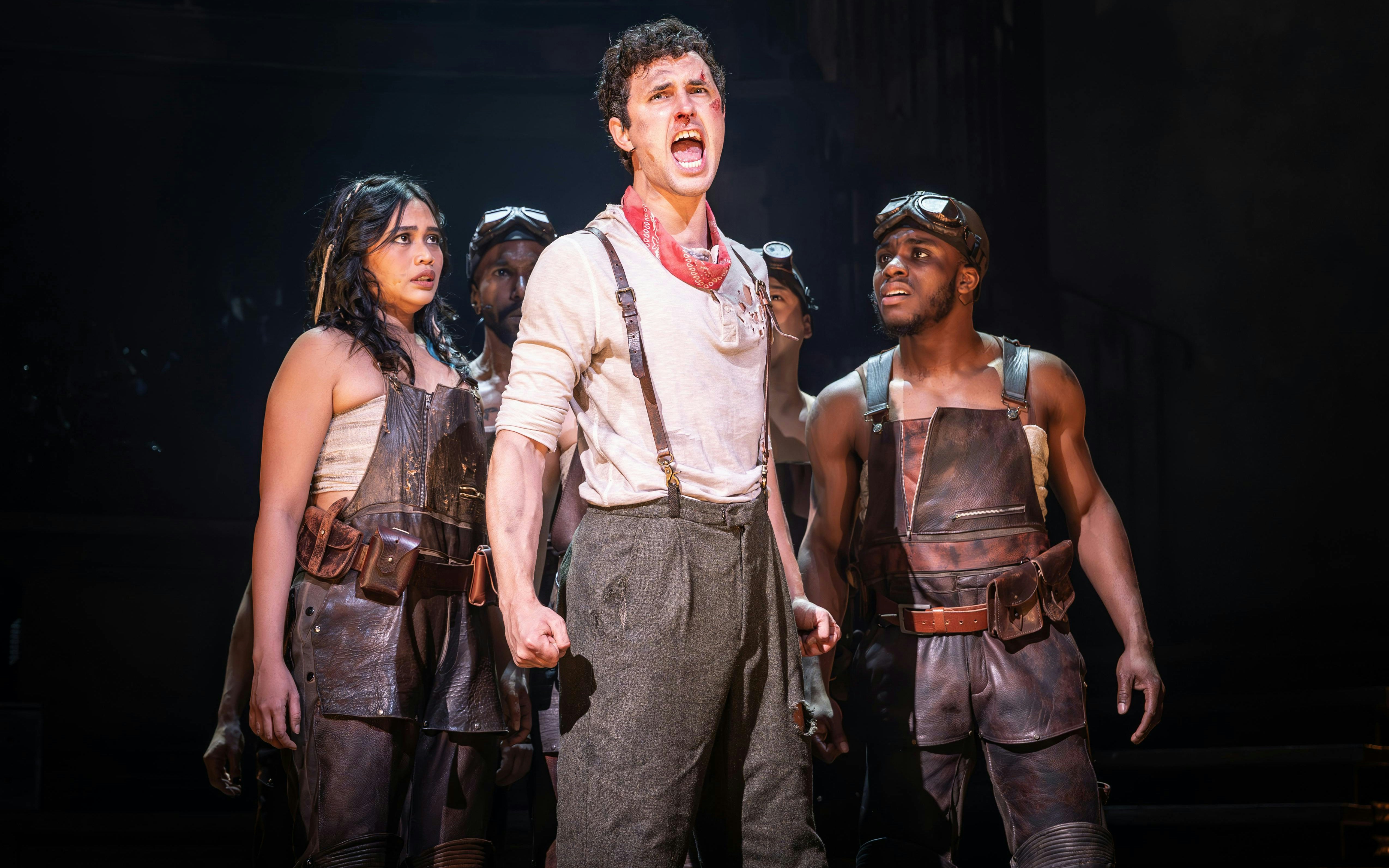 Performers on stage during Hadestown musical in West End.