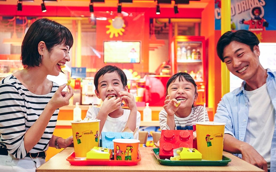Family enjoying snacks at LEGOLAND Discovery Center Tokyo.