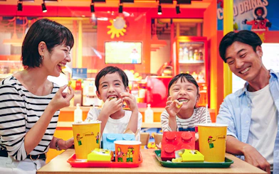 Family enjoying snacks at LEGOLAND Discovery Center Tokyo.