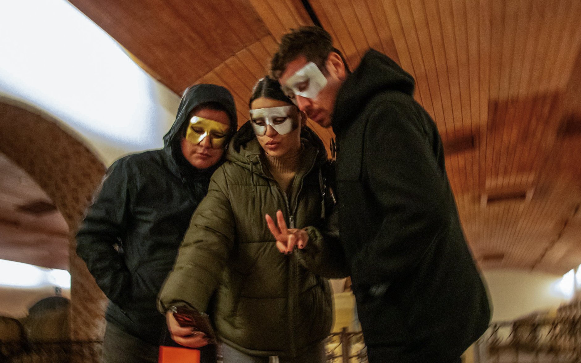 Tourists in masks enjoying Viña Concha y Toro nighttime dinner show.