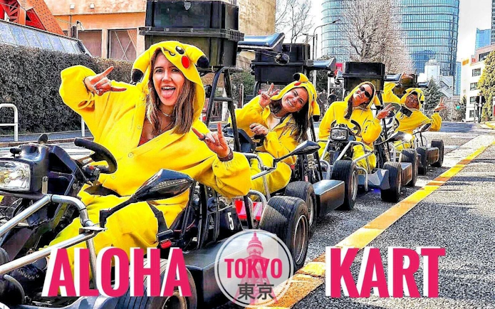 Tourists in Pikachu costumes on go-karts during a guided tour in Tokyo.