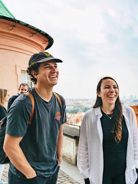 Tourists enjoying a view of Prague's historic architecture during a city tour.