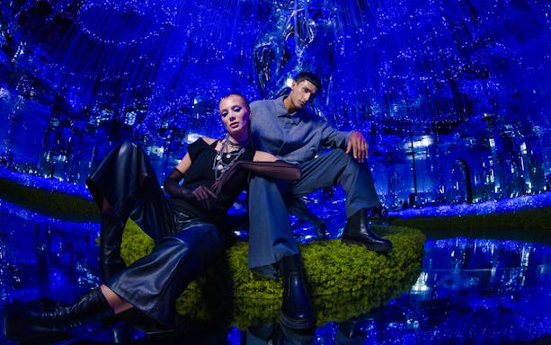 Visitors exploring the vibrant AYA Universe light installation in Dubai, UAE.
