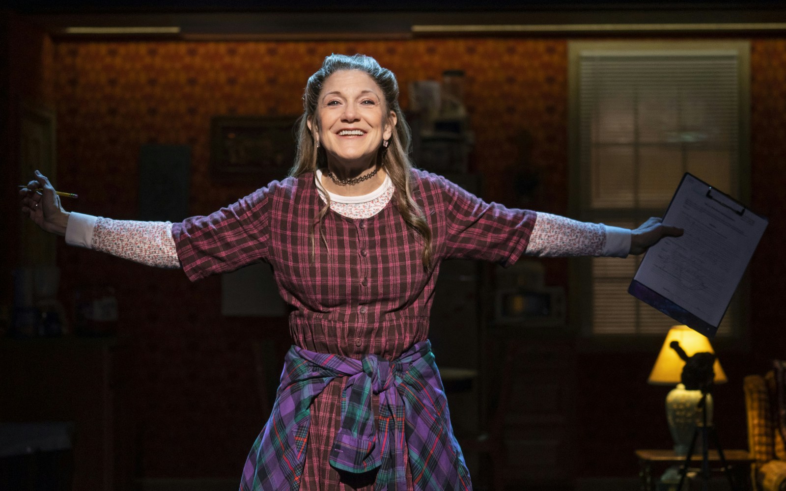 Performer on stage in a scene from Kimberly Akimbo musical.