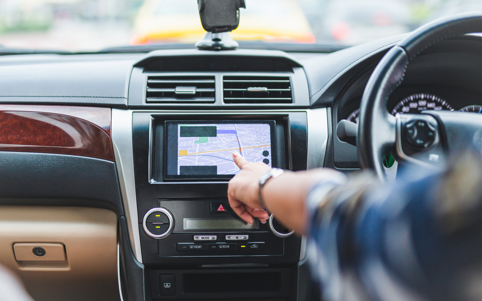 car with GPS navigation system in urban setting.