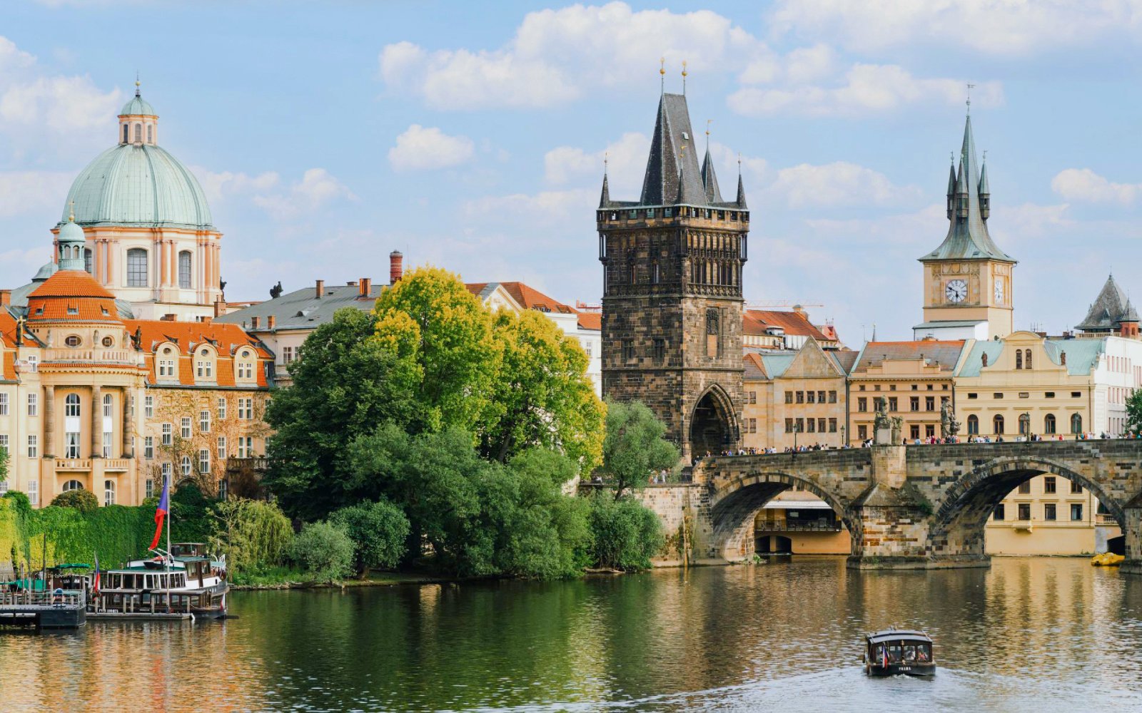 Old Town Bridge Tower and Charles Bridge over Vltava River in Prague.