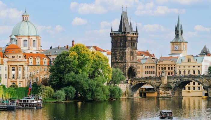 Old Town Bridge Tower and Charles Bridge over Vltava River in Prague.