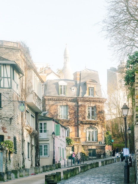 Montmartre street view with historic buildings on Emily in Paris walking tour.