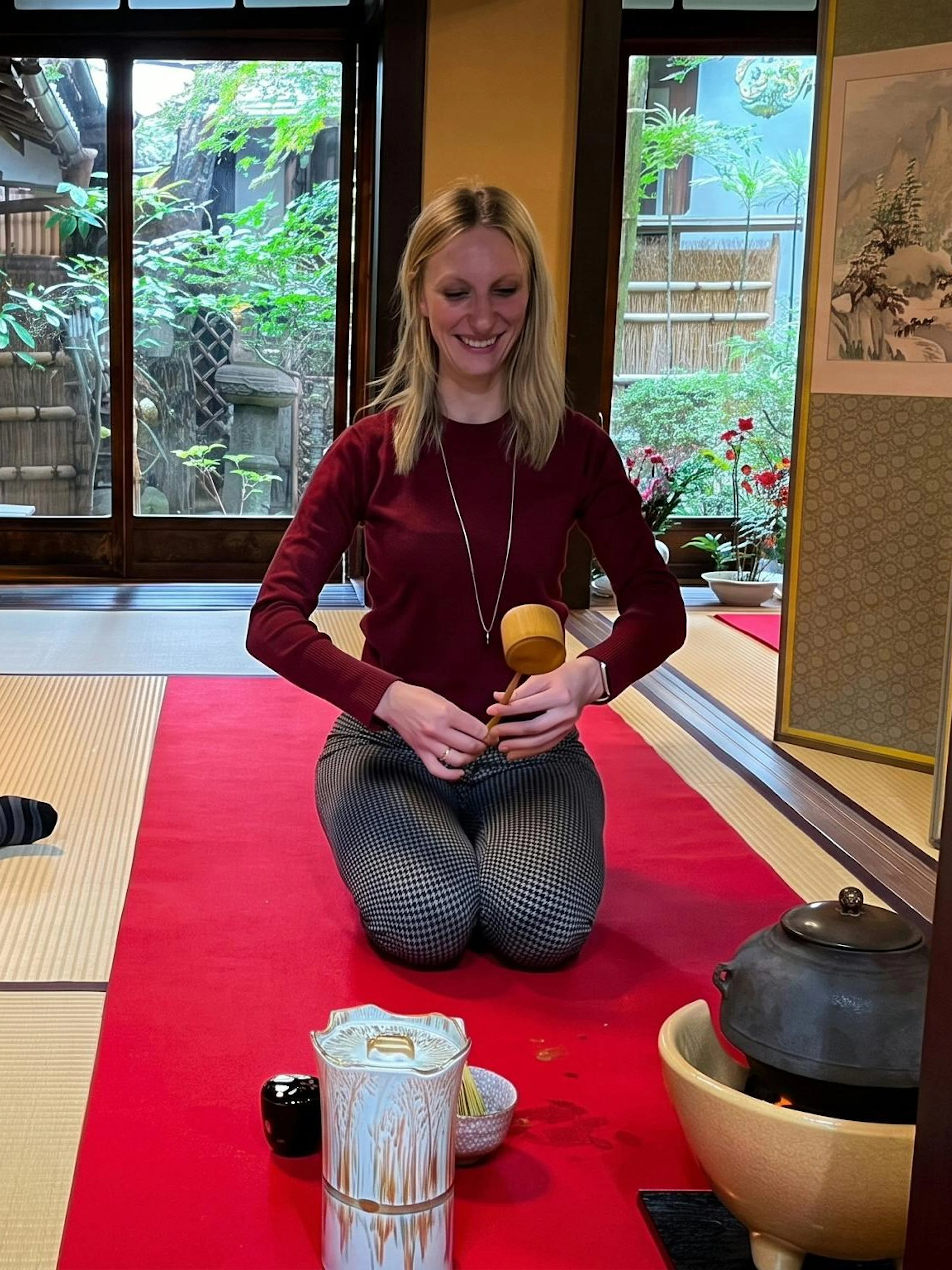 Couple participating in a tea ceremony in a traditional Kyoto tea room.