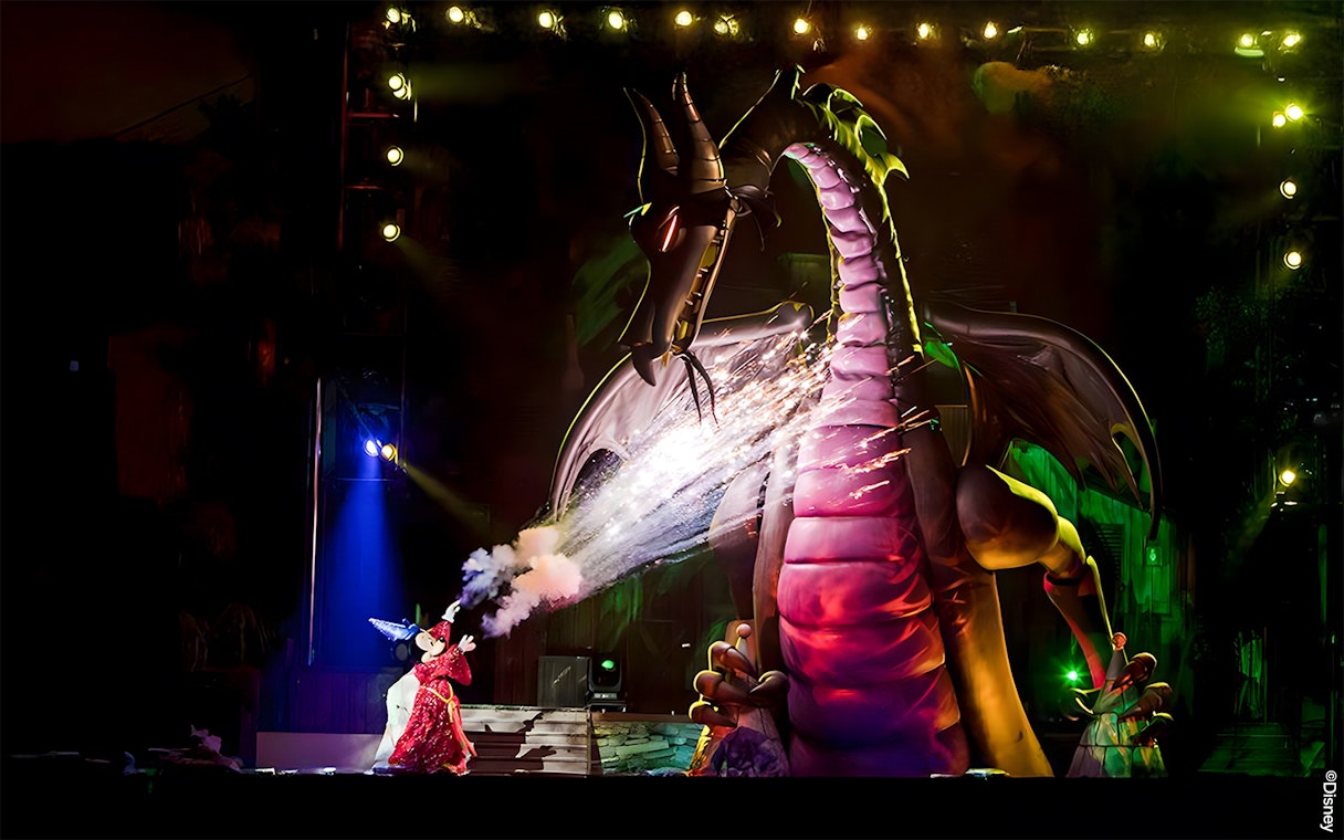 Mickey battling a dragon during a live show at Disneyland Park, California.