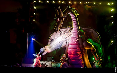 Mickey battling a dragon during a live show at Disneyland Park, California.