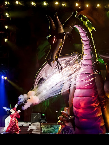 Mickey battling a dragon during a live show at Disneyland Park, California.